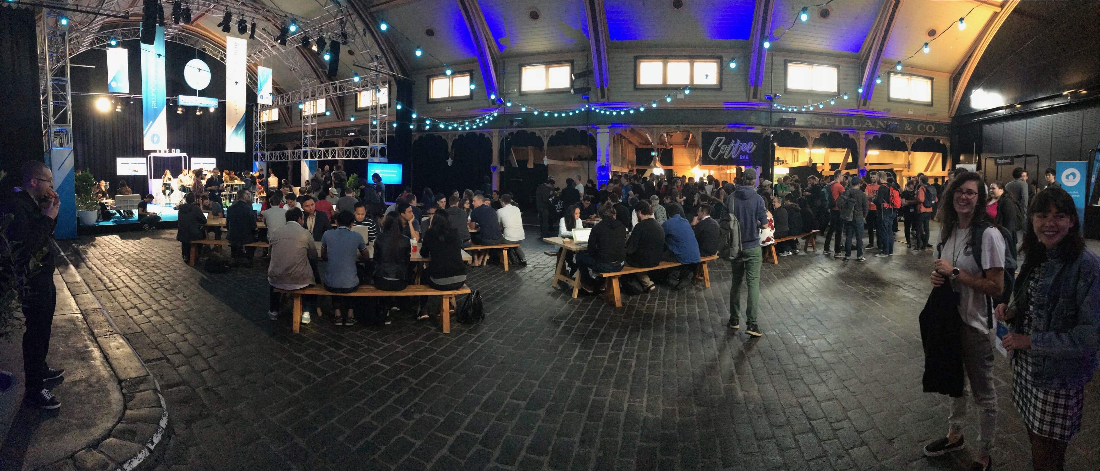 JSConf-goers enjoying the complimentary coffee on the first day of the event (and some cheery Abletechers on the right!)